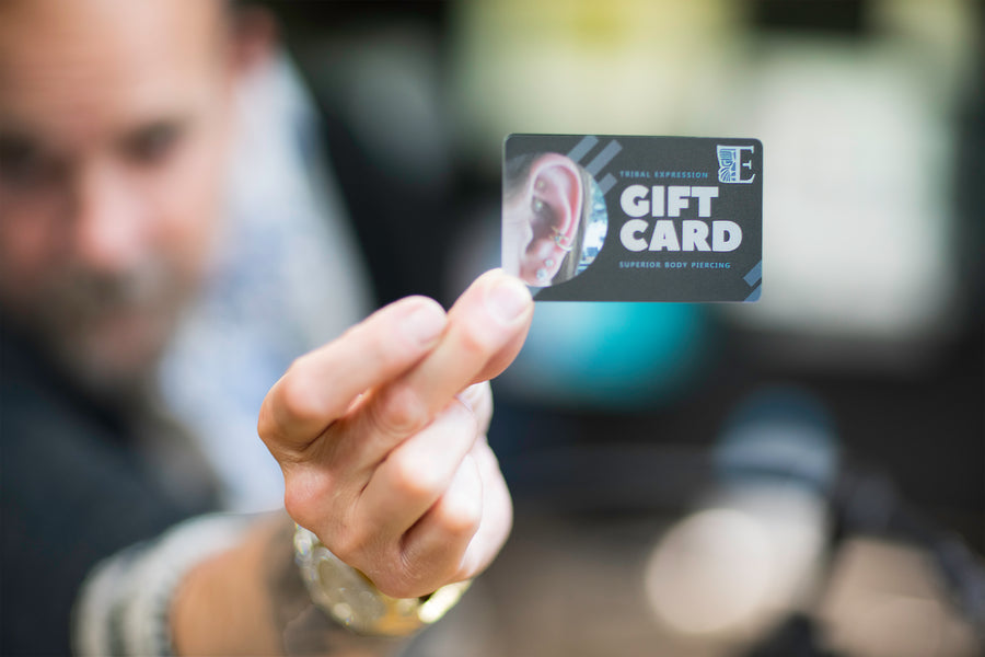 Tribal Expression gift card held in an outstretched hand