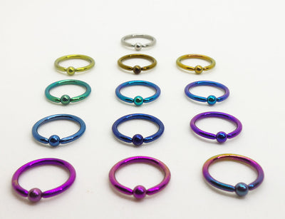 Titanium captive bead rings arranged by anodized colour