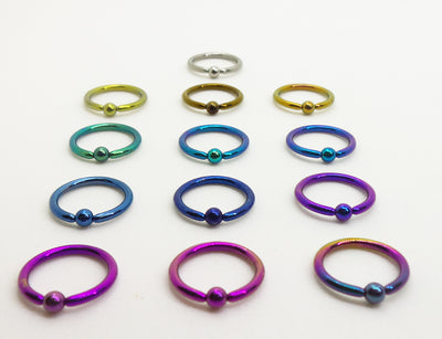 Titanium captive bead rings arranged by anodized colour