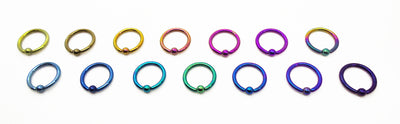 Titanium captive bead rings arranged by anodized colour