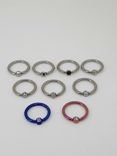 Polished, blue and pink captive bead rings