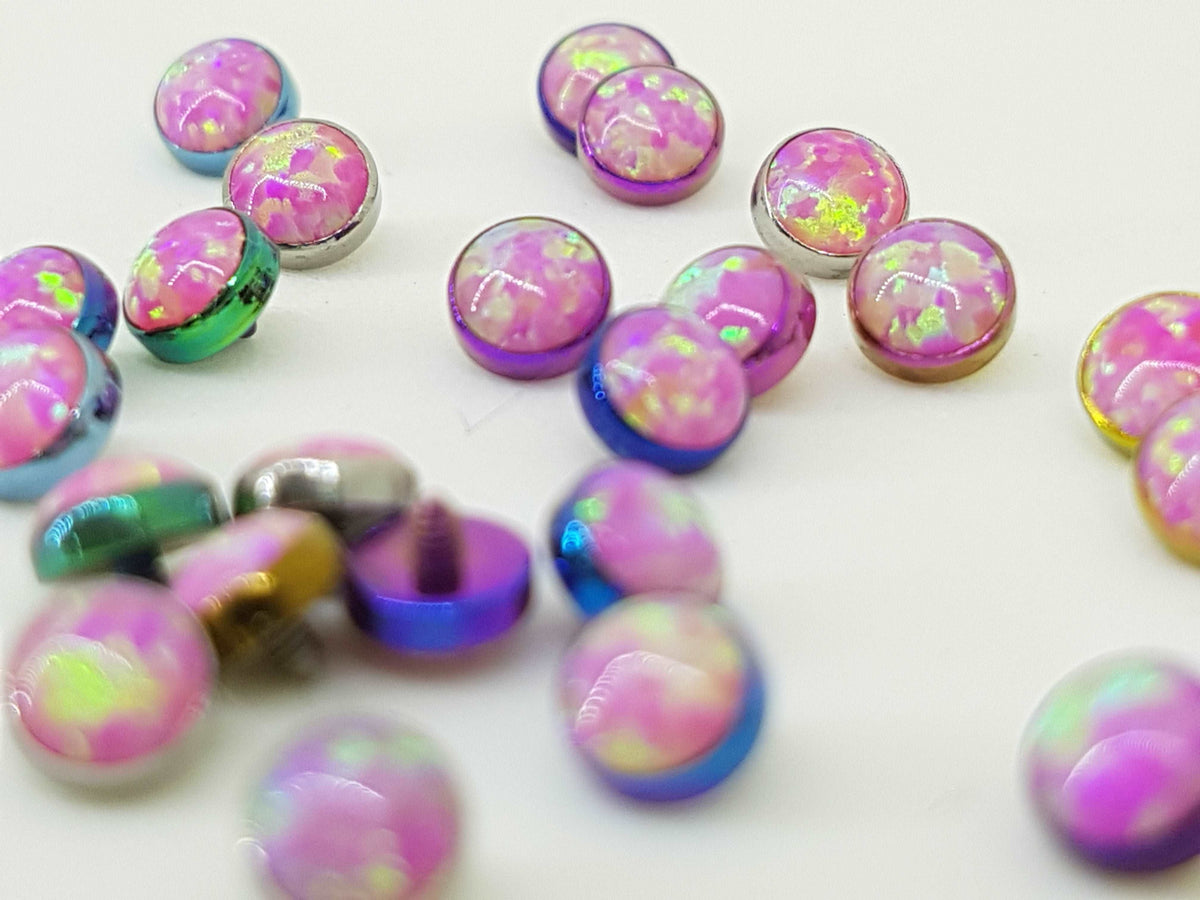 Pink opal-look jewelry ends in pink titanium settings