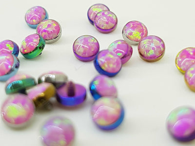 Pink opal-look jewelry ends in pink titanium settings