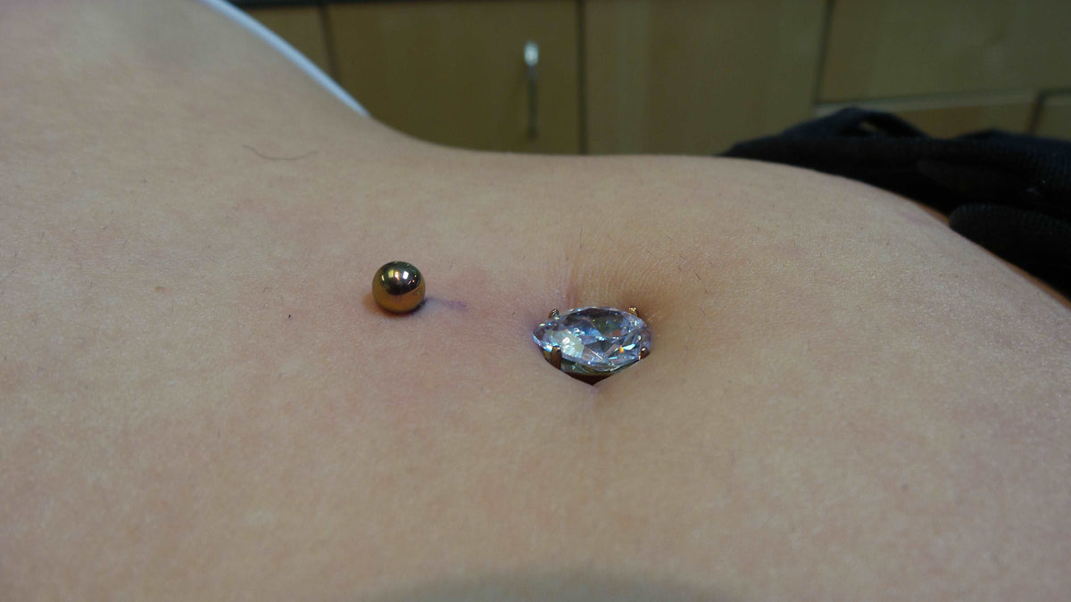 Teardrop gemstone jewelry worn in a navel piercing