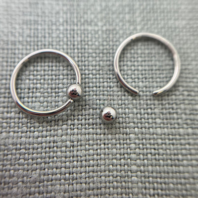 Stainless steel captive bead rings with one bead removed