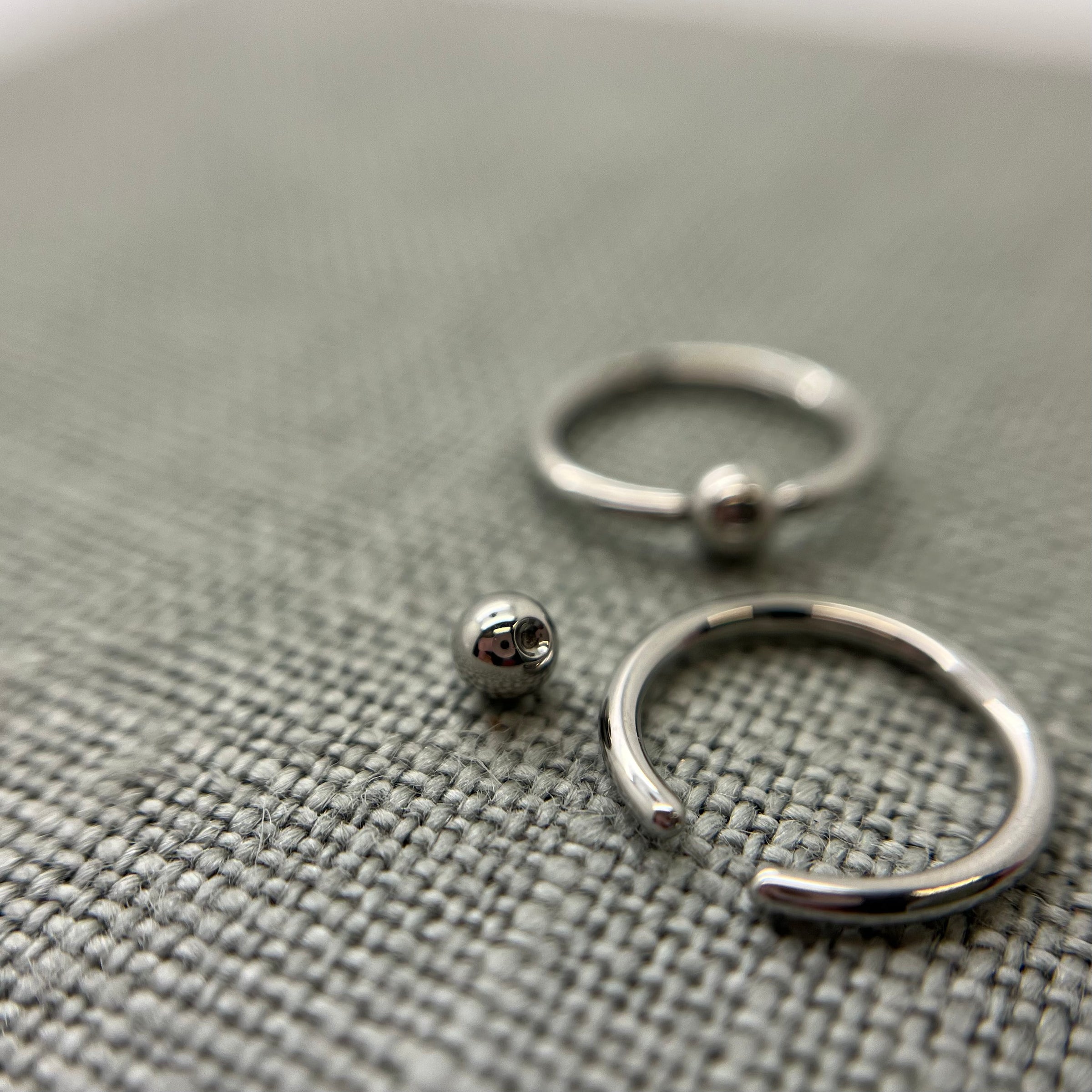 Stainless steel captive bead rings shown with removable beads