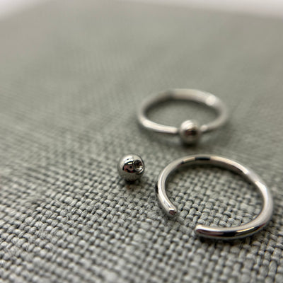 Stainless steel captive bead rings shown with removable beads