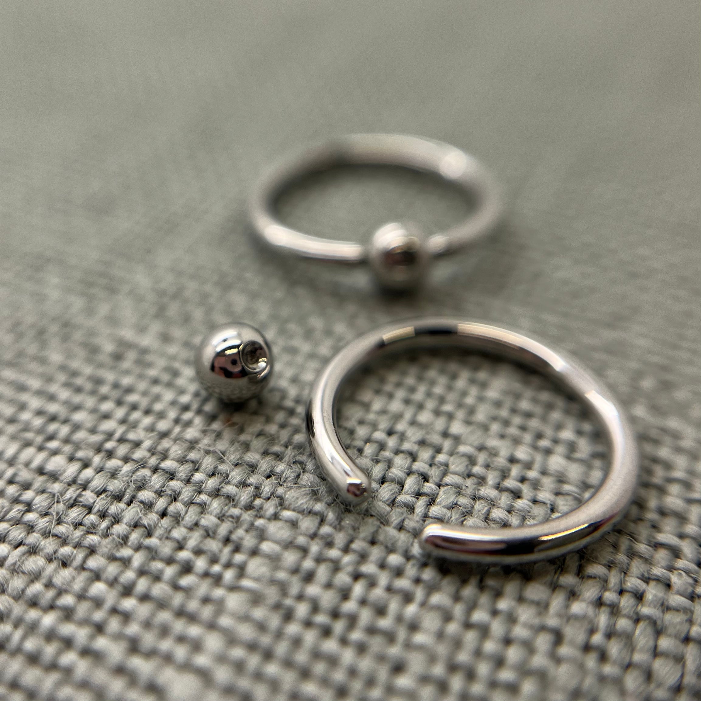Stainless steel captive bead rings shown with removable beads