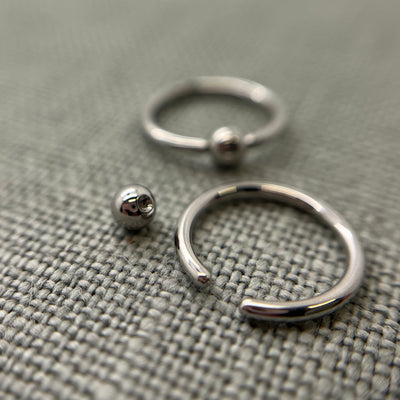 Stainless steel captive bead rings shown with removable beads