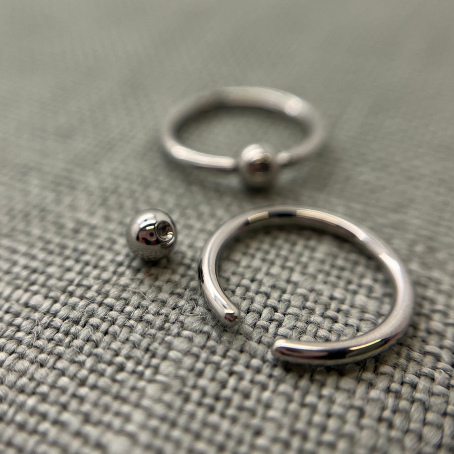 Stainless steel captive bead rings shown with removable beads