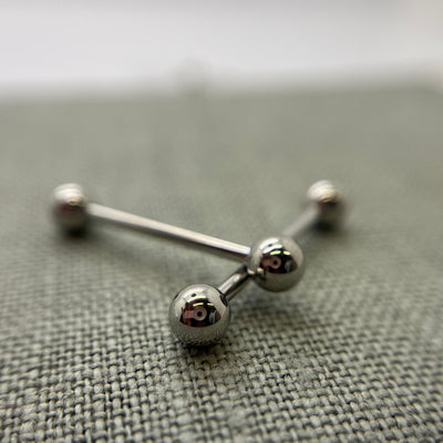 Crossed stainless steel straight barbells with round beads