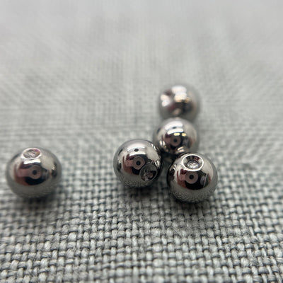 Polished stainless steel replacement beads for captive bead rings