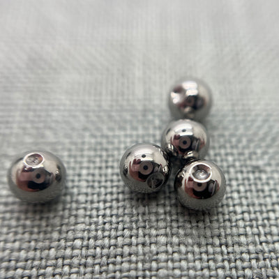 Polished stainless steel replacement beads for captive bead rings