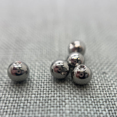 Polished stainless steel replacement beads for captive bead rings