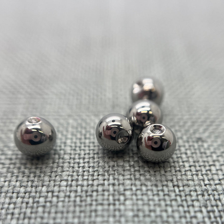 Polished stainless steel replacement beads for captive bead rings