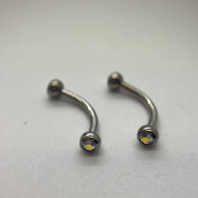 Stainless steel curved barbells with iridescent cubic zirconia ends