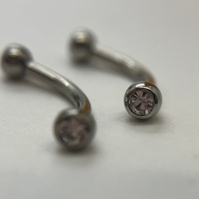 Stainless steel curved barbells with clear cubic zirconia ends