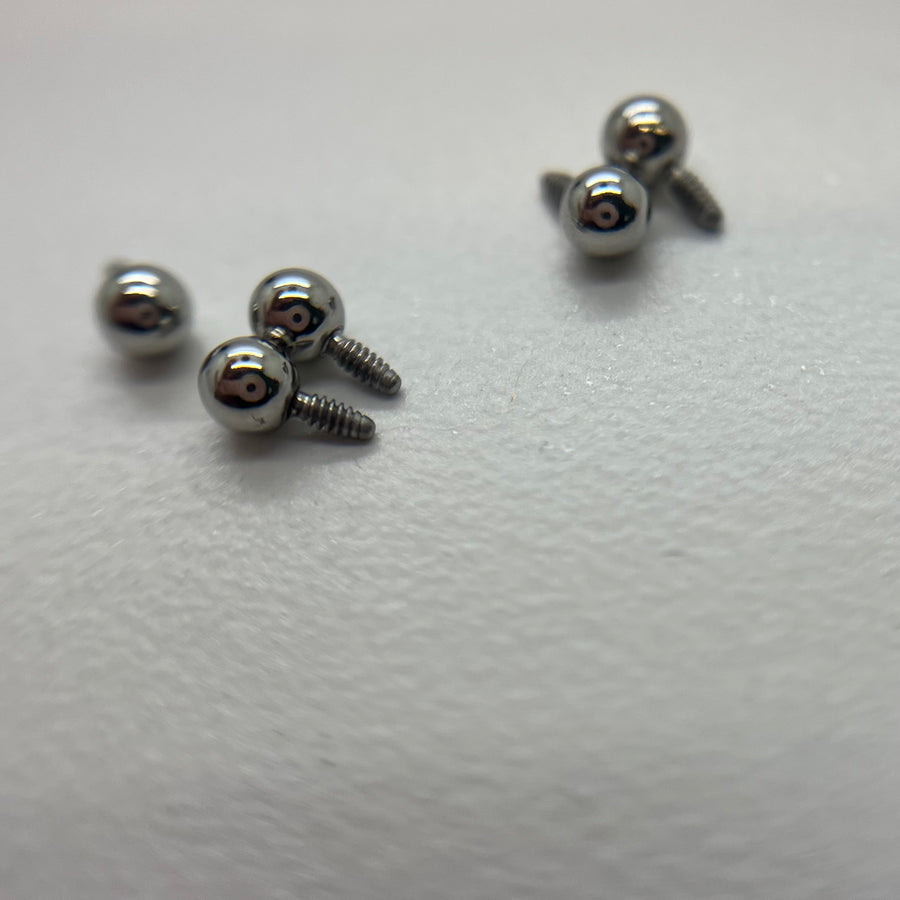 Stainless steel threaded jewelry beads with screw threads visible