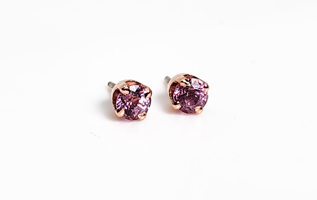 Pair of pink sapphire jewelry ends in rose gold settings