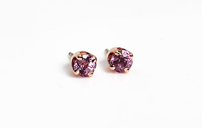 Pair of pink sapphire jewelry ends in rose gold settings