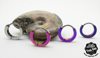 Titanium snap-lock clickers in silver, pink and purple finishes