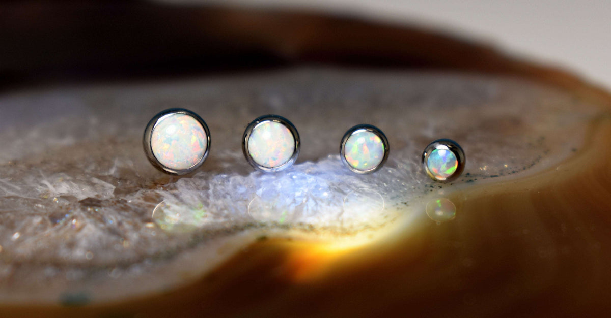 Titanium synthetic opal jewelry ends in graduated sizes