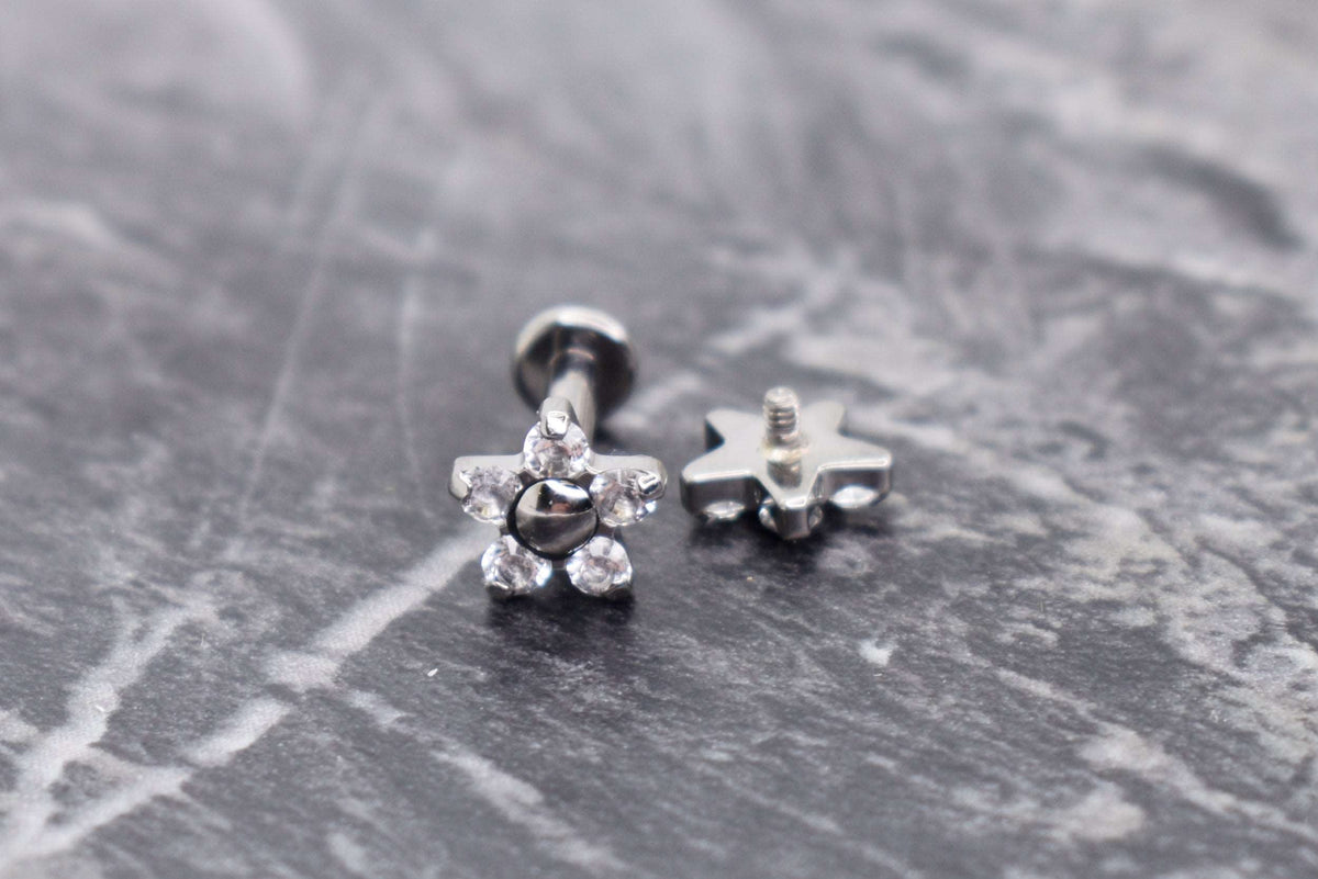 Flower-shaped titanium jewelry ends with clear gemstones