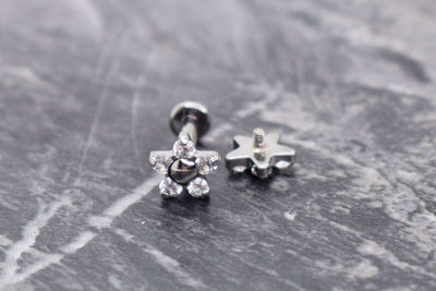 Flower-shaped titanium jewelry ends with clear gemstones