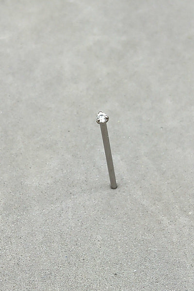 Straight titanium nostril stud with a clear prong-set gemstone