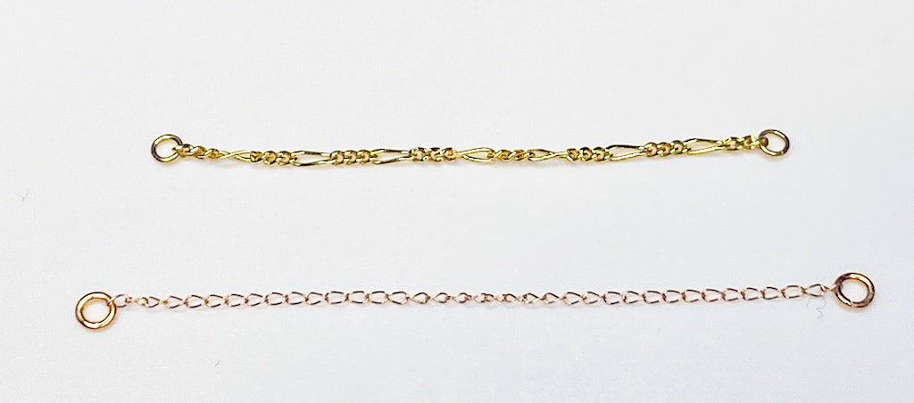 Two gold curation chains with attachment loops