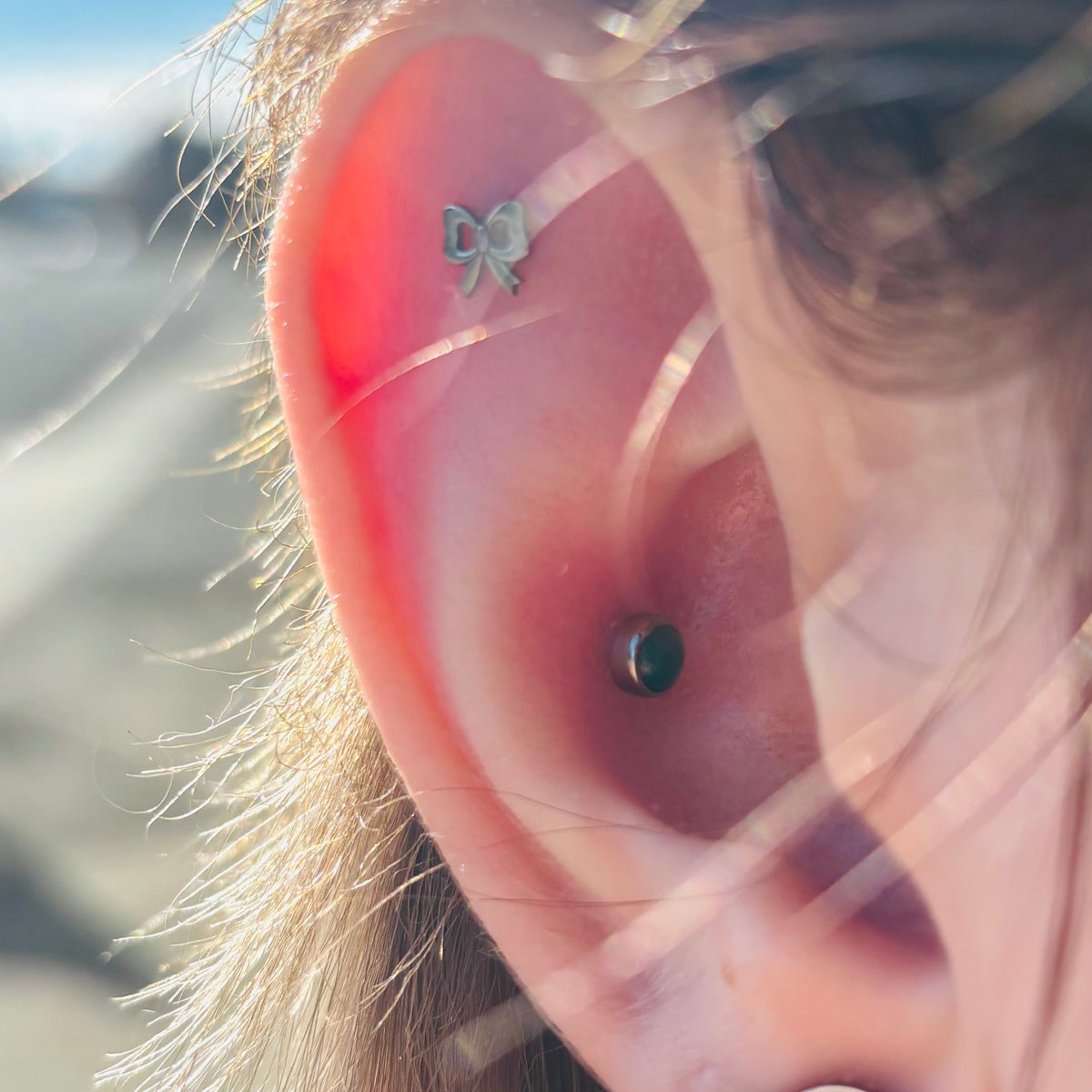 Green agate jewelry worn in a conch piercing