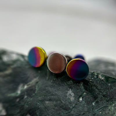 Round titanium disc ends with bronze and rainbow anodized finishes