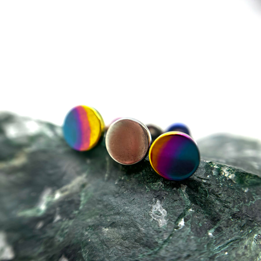 Round titanium disc ends with bronze and rainbow anodized finishes