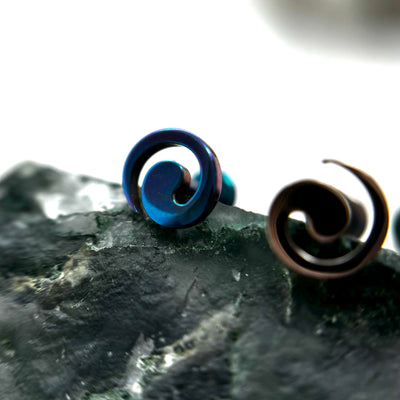 Spiral-shaped titanium jewelry ends in assorted anodized colours