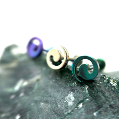 Spiral-shaped titanium jewelry ends in assorted anodized colours