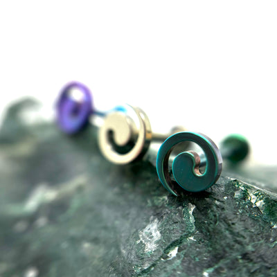 Spiral-shaped titanium jewelry ends in assorted anodized colours