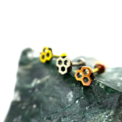 Honeycomb-shaped titanium ends in gold, polished and copper-toned finishes