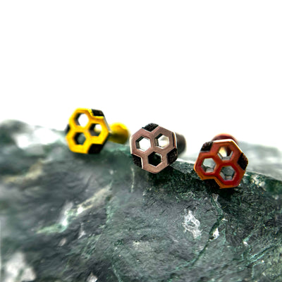 Honeycomb-shaped titanium ends in gold, polished and copper-toned finishes