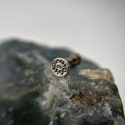 Silver sprinkled doughnut-shaped jewelry end on a flat-back post