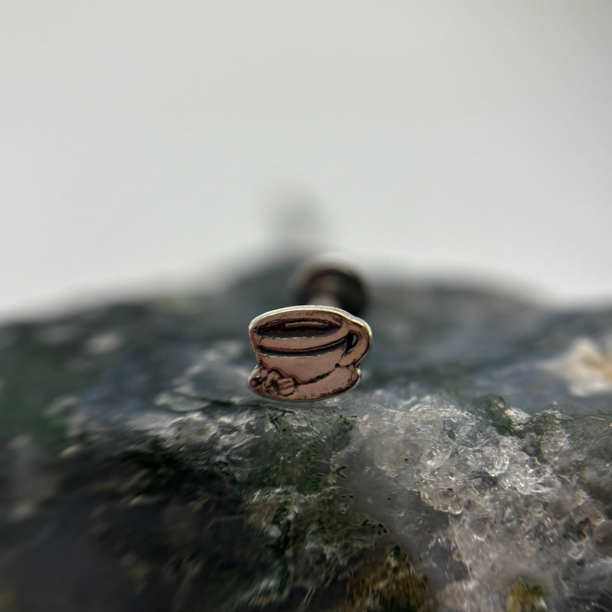 Silver espresso cup-shaped jewelry end on a flat-back post