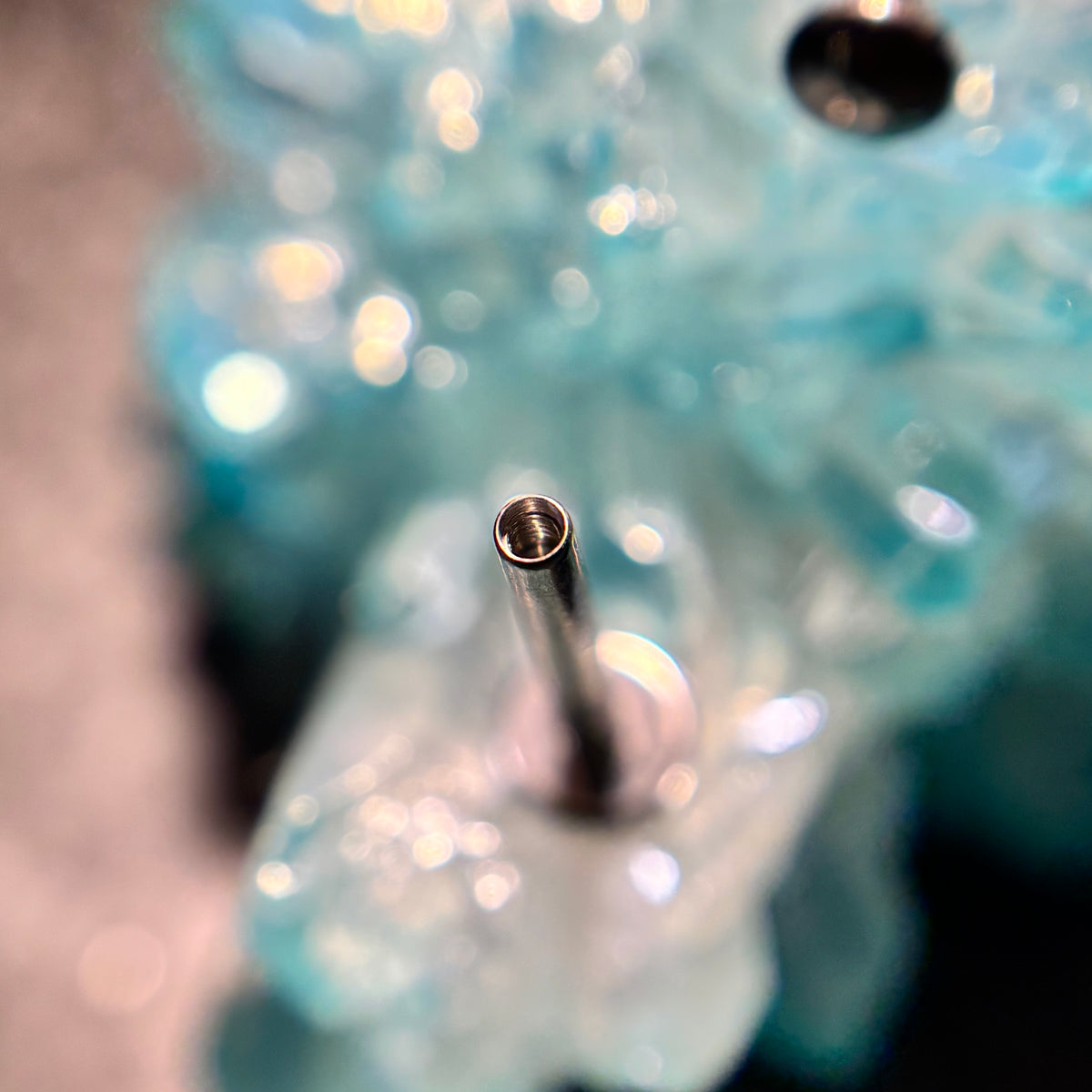Open threaded end of a flat-back jewelry post