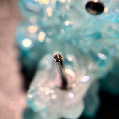 Open threaded end of a flat-back jewelry post