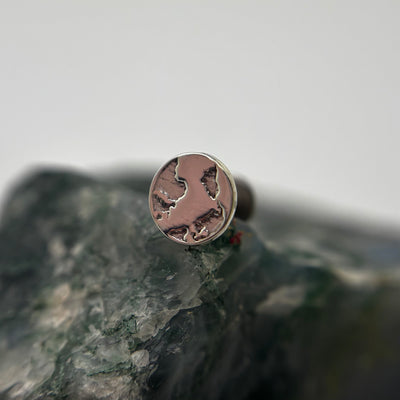 Silver Earth-shaped threadless end with engraved continents on a flat-back post