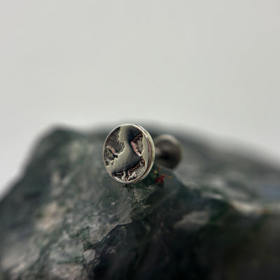 Silver Earth-shaped threadless end with engraved continents on a flat-back post
