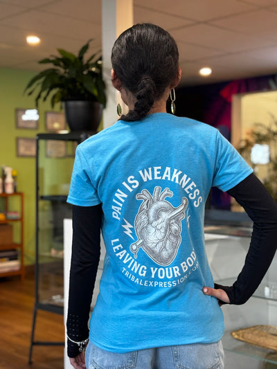 Blue Tribal Expression T-shirt worn with the heart graphic visible on the back