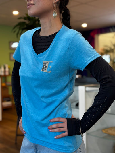 Front of blue Tribal Expression T-shirt with a small chest logo