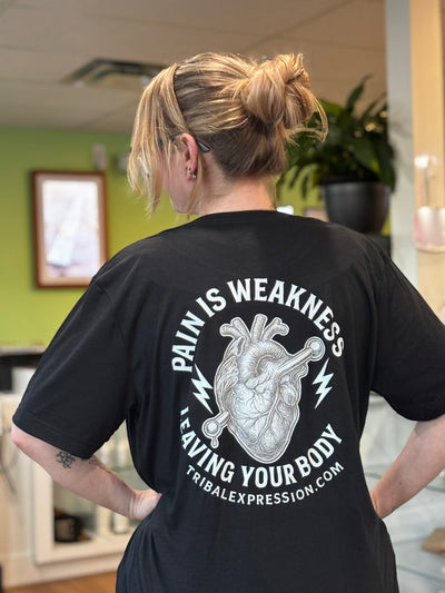 Black Tribal Expression T-shirt worn with the heart graphic visible on the back
