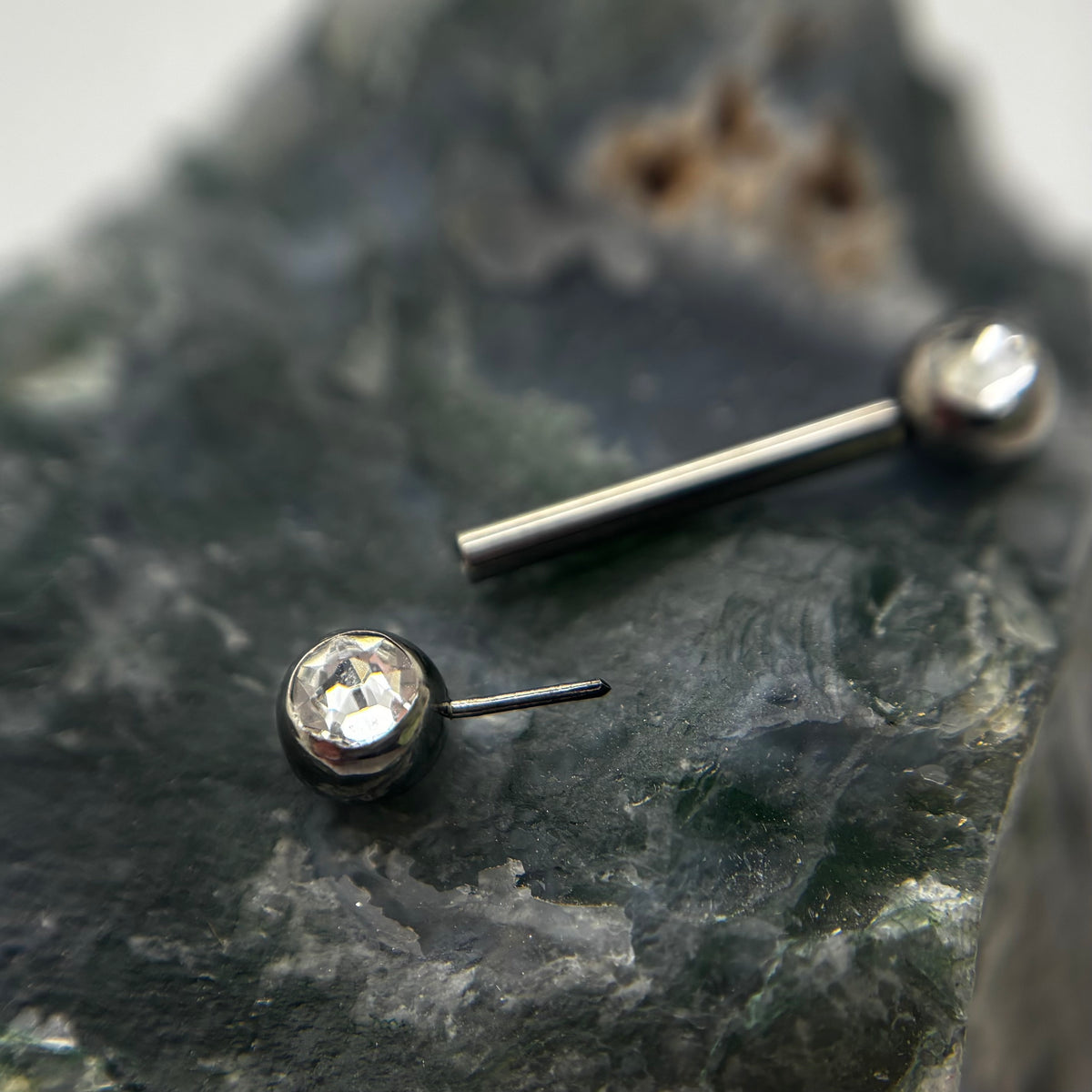 Clear gemstone threadless nipple jewelry end removed from its barbell
