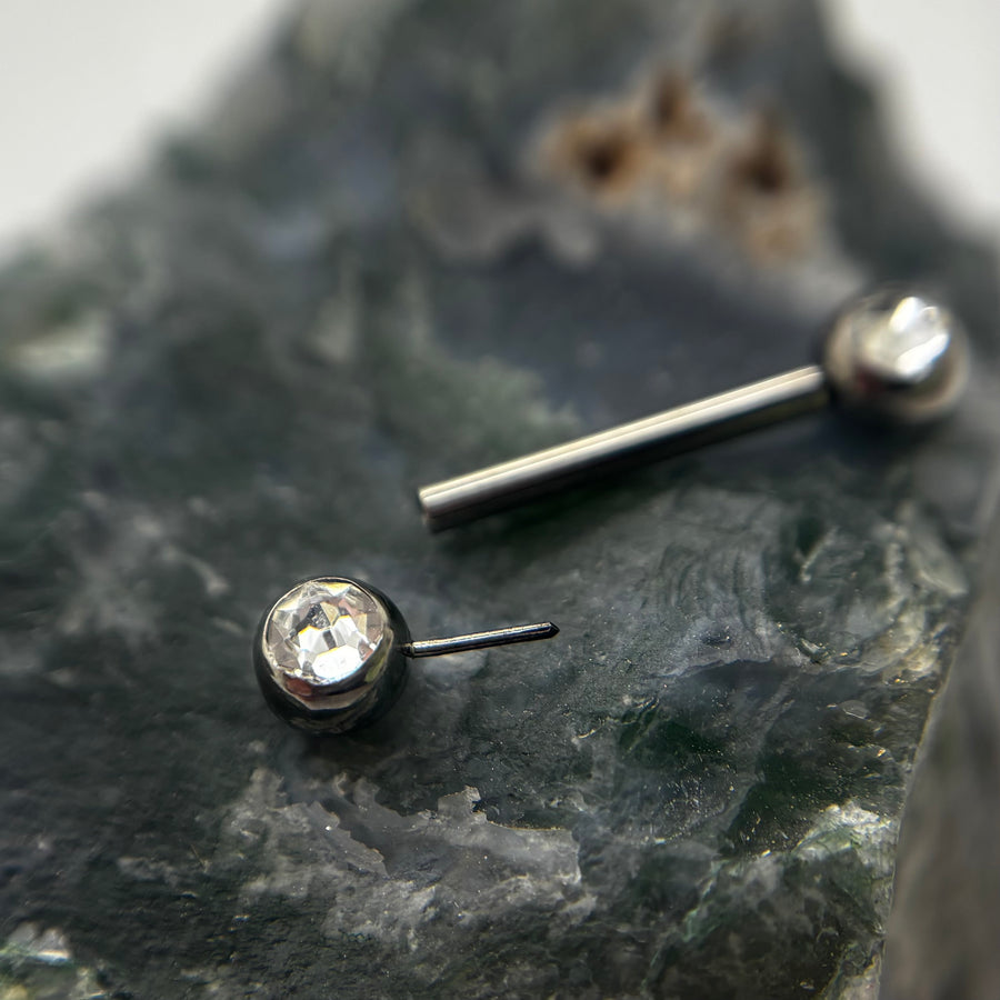 Clear gemstone threadless nipple jewelry end removed from its barbell