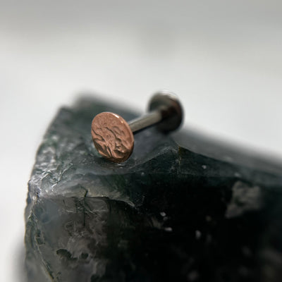 Textured rose gold disc end on a flat-back post